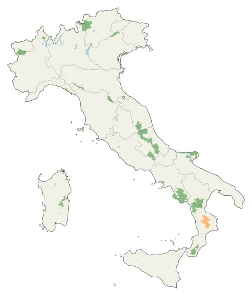 Map of Italy showing green areas representing national parks and protected areas, with an orange highlight in southern Italy indicating Sila National Park