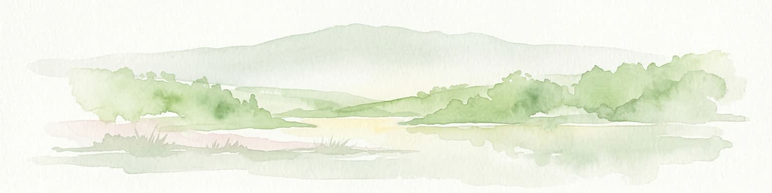 Watercolor painting depicting a lake with green hills and vegetation