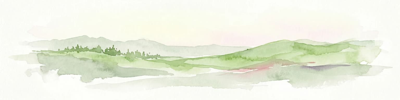 Watercolor painting of rolling green hills and distant forested mountains under a light sky