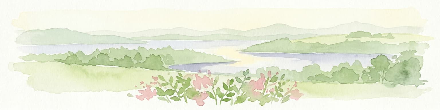 Watercolor painting showing a river with green hills and pink flowers in the foreground