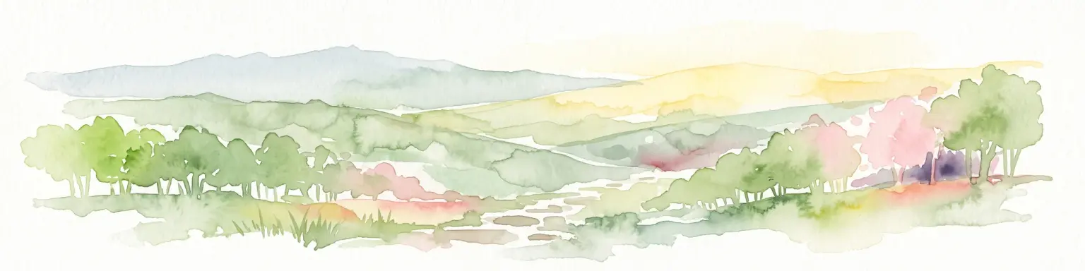 A watercolor painting showing a rolling landscape with distant mountains, soft green and pink trees, and gentle hills on a plain white background.