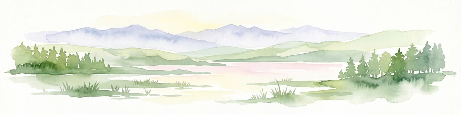 Watercolor illustration of a lake with mountains in the background, surrounded by trees and grass