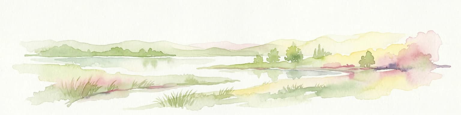 Watercolor painting of a river, hills, and trees with pink and yellow sky tones