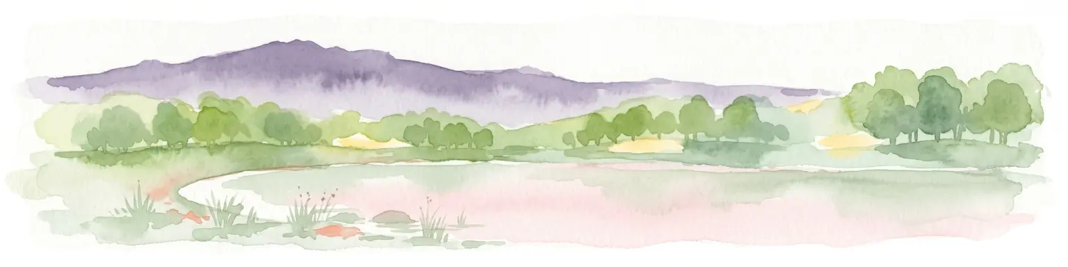 A horizontal watercolor painting depicting a landscape with a foreground pond, rolling hills covered in sparse forest, and distant purple-toned mountains under a white sky.