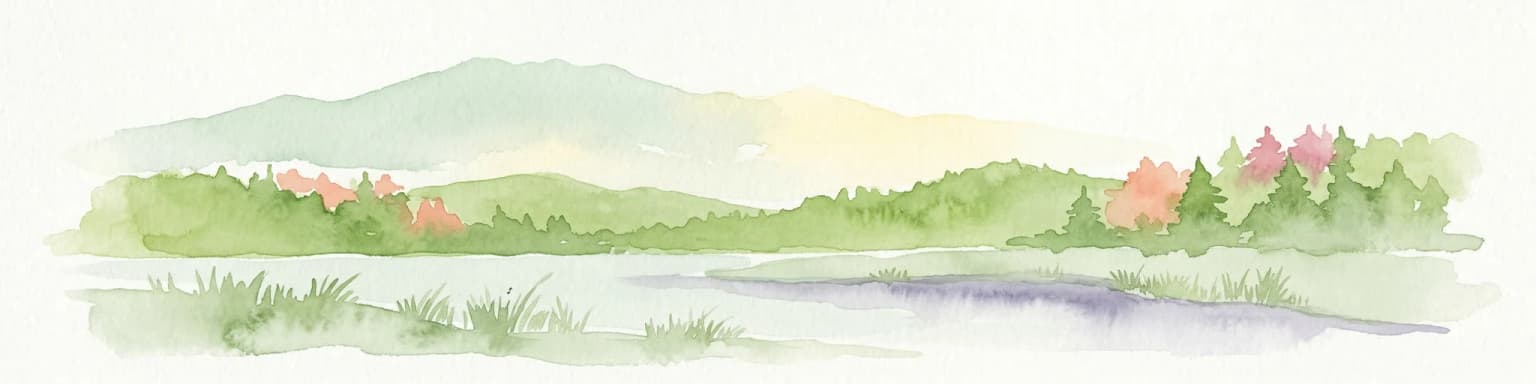 Watercolor painting of a lake surrounded by green hills and trees with colorful foliage