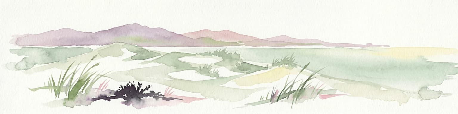 Watercolor painting of sandy dunes with patches of grass, distant mountains, and a body of water under a light sky