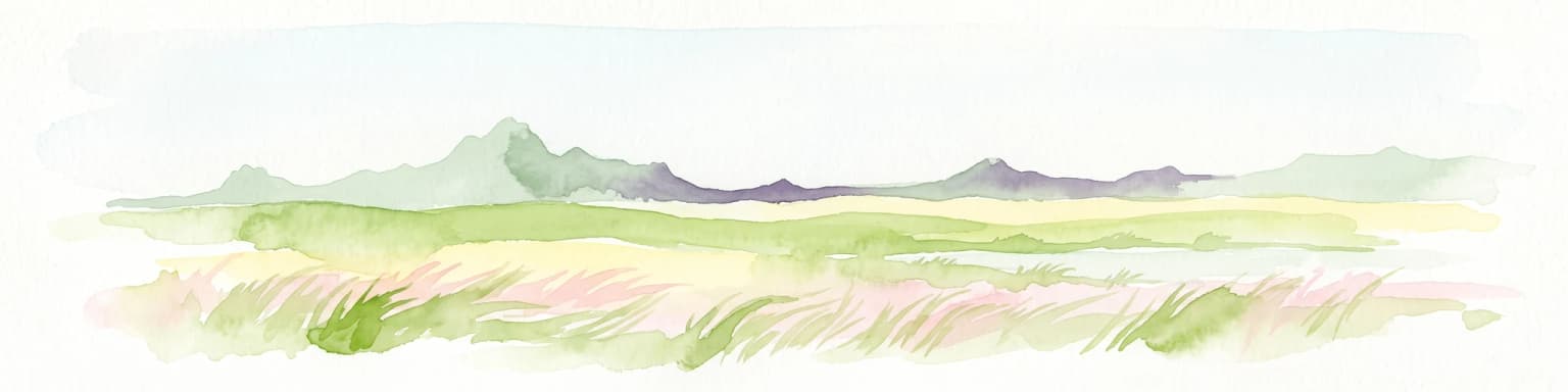 Watercolor painting of a wide, rolling grassy plain leading to distant low hills or badlands against a pale sky.