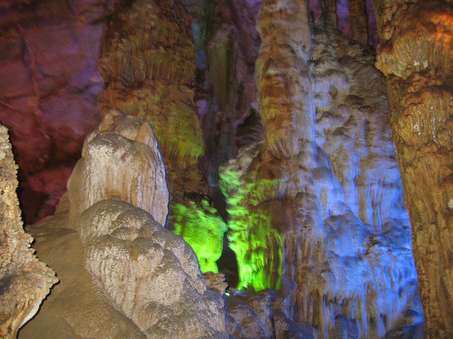 Cave interior with colorful illuminated stalactites and stalagmites in Phong Nha-Kẻ Bàng National Park