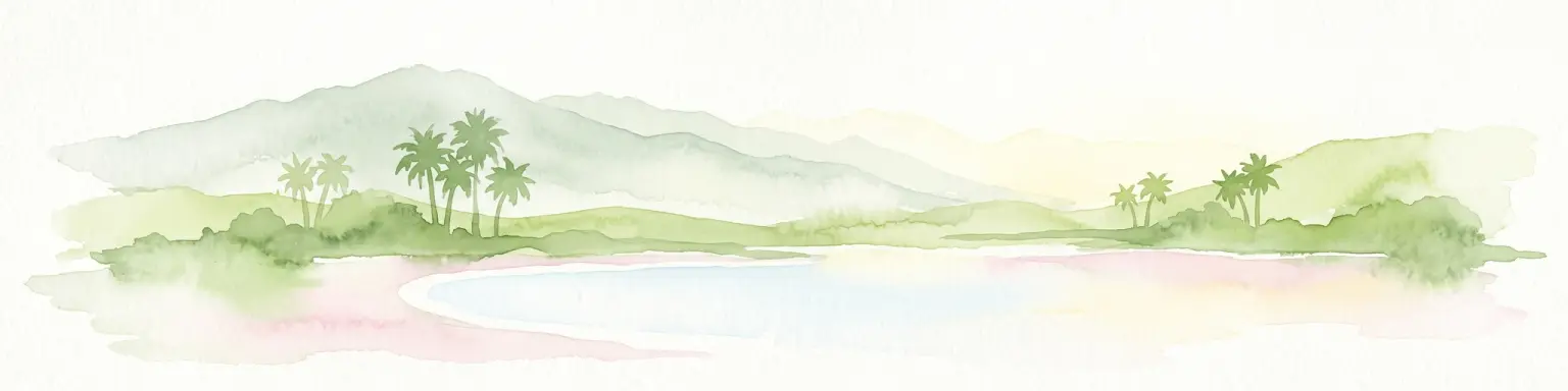 A soft watercolor painting of a tropical coastal landscape featuring a calm bay, low rolling hills in the background, and clusters of palm trees.