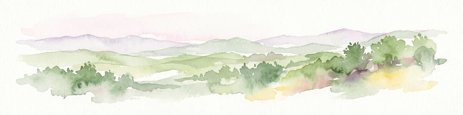 A wide watercolor painting showing a landscape of green rolling hills with trees in the foreground and layers of purple mountains in the background against a white background.
