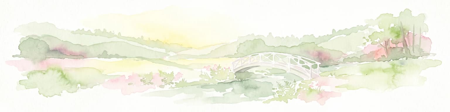 A pale, soft watercolor painting depicting a small arched bridge crossing a gentle stream within a rolling green valley.
