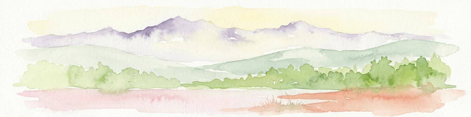Watercolor painting showing mountain range with green forests and colorful landforms