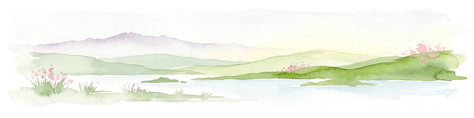 A soft watercolor painting showing green rolling hills, a calm body of water, and small clusters of pink flowers against a light, hazy background.