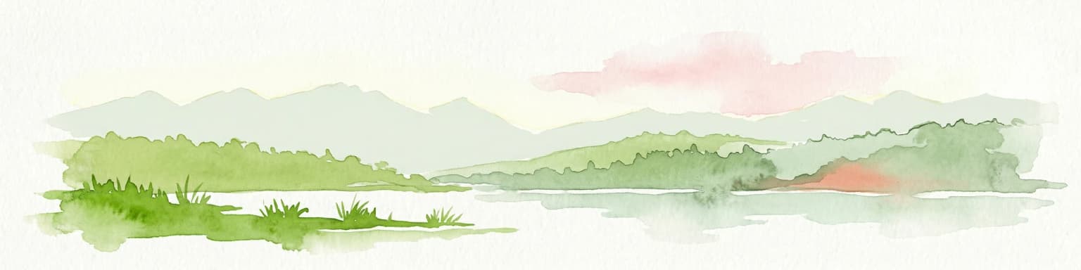 Watercolor illustration of a lake with mountains and greenery under a pink-hued sky