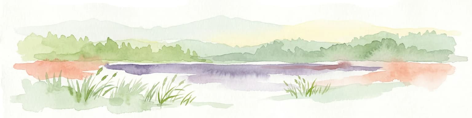 Watercolor illustration of a lake with green forests and grassy foreground, distant hills, and purple and orange water tones