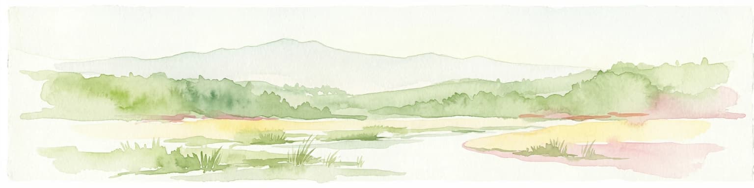 Watercolor painting showing a river, grassy areas, and forested hills in the background