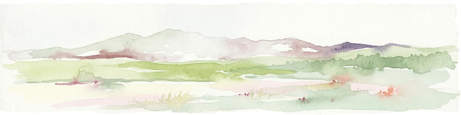 Watercolor illustration of a mountainous landscape with green fields in the foreground and distant mountains under a pale sky