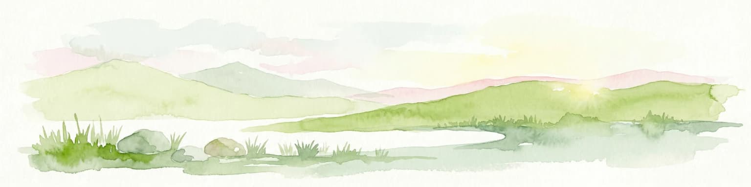 Watercolor painting depicting a mountain range, lake, and grassy foreground under a pale sky